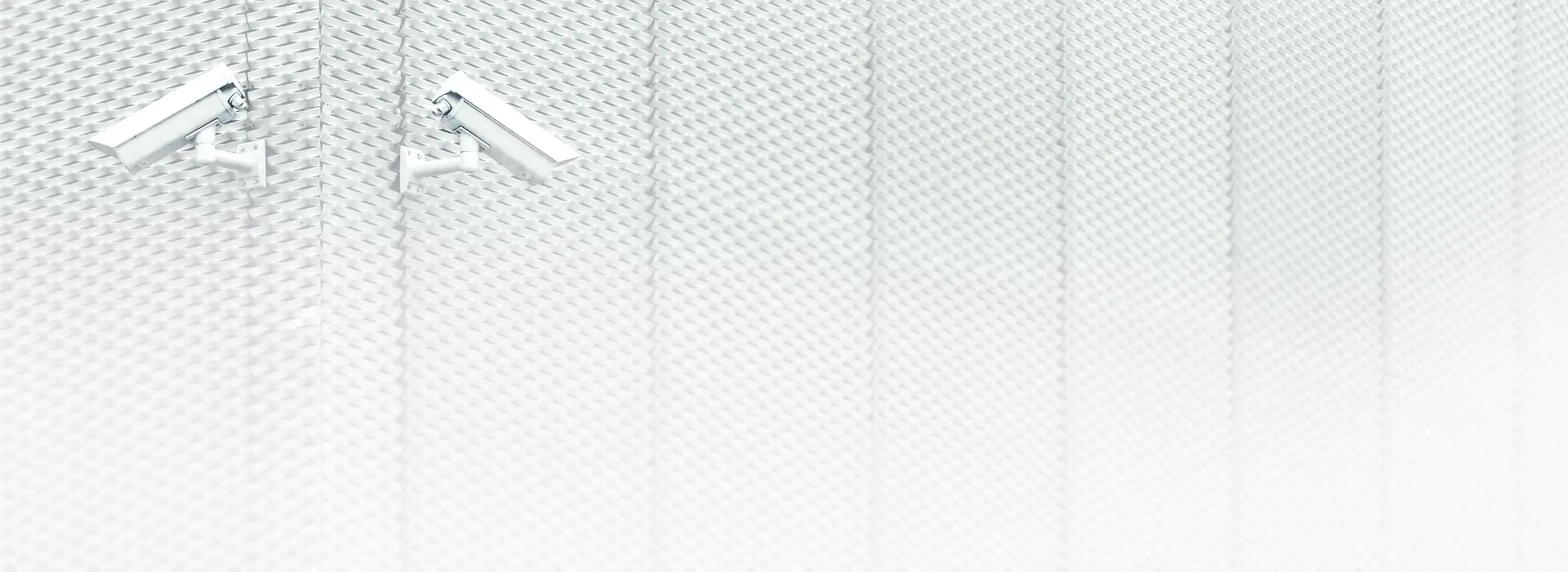 Security cameras mounted on building